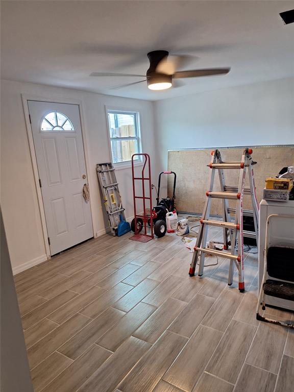 1550 Roundtree Road Holiday, FL 34690 - Photo 3 of 6 a view of a workspace with furniture and a window