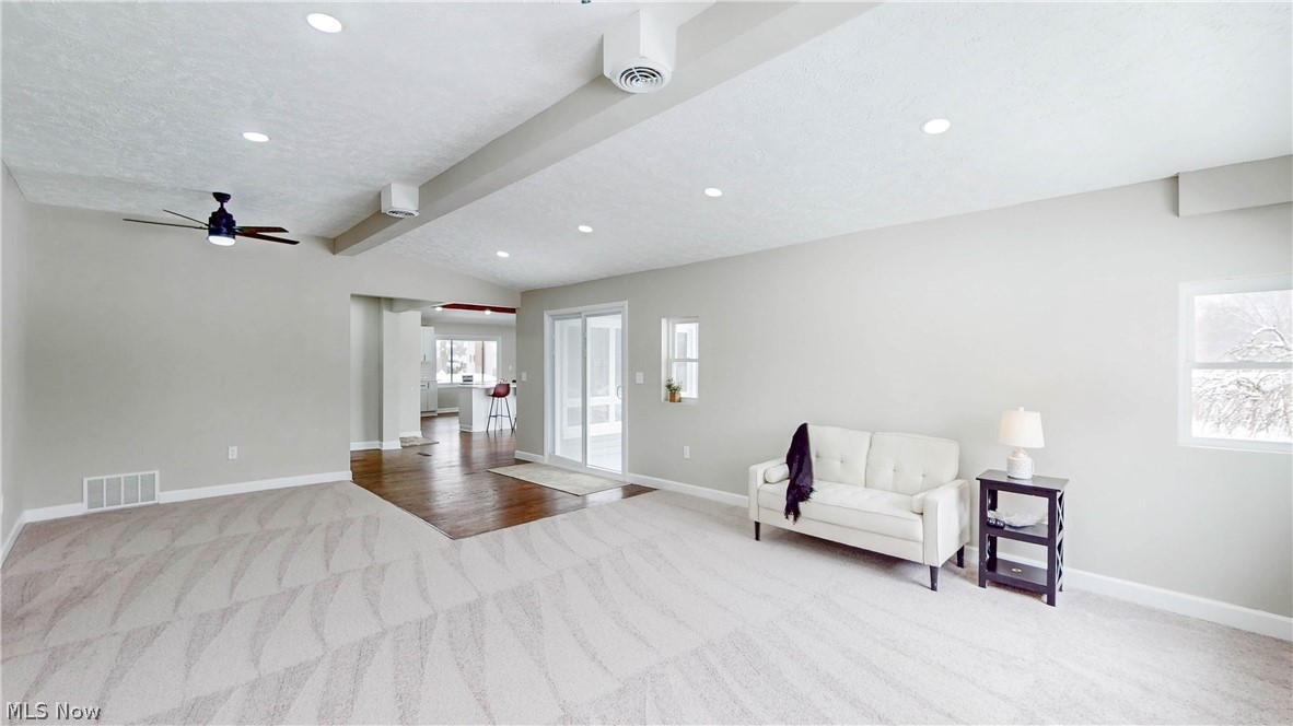 3312 Bancroft Road Akron, OH 44333 - Photo 14 of 50 Sitting room with vaulted ceiling with beams, light carpet, ceiling fan, and recessed lighting