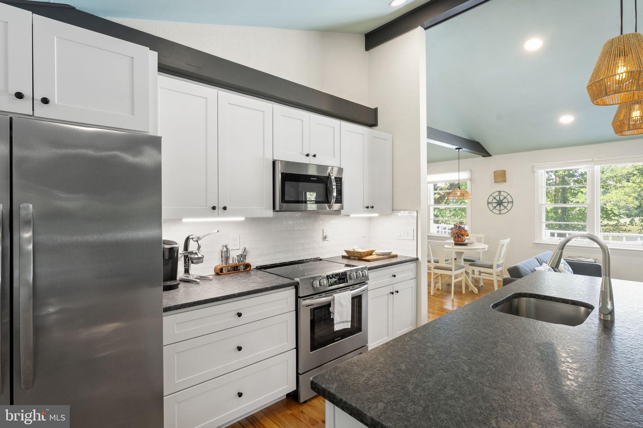139 Knollwood Road Elkton, MD 21921 - Photo 11 of 57 a kitchen with granite countertop a sink stainless steel appliances and cabinets