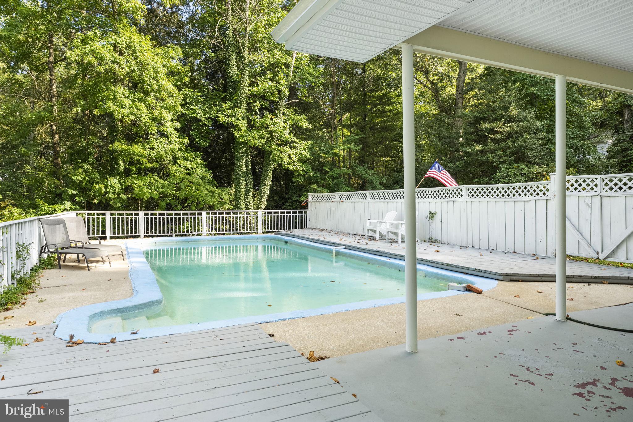 139 Knollwood Road Elkton, MD 21921 - Photo 30 of 57 a view of a balcony with floor to ceiling windows and wooden fence