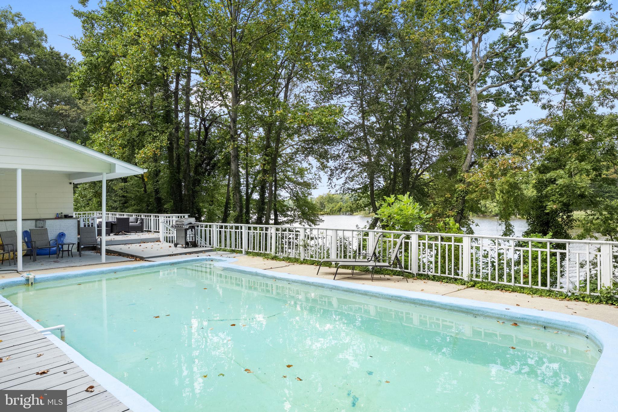 139 Knollwood Road Elkton, MD 21921 - Photo 34 of 57 a view of a patio with chairs and a big yard