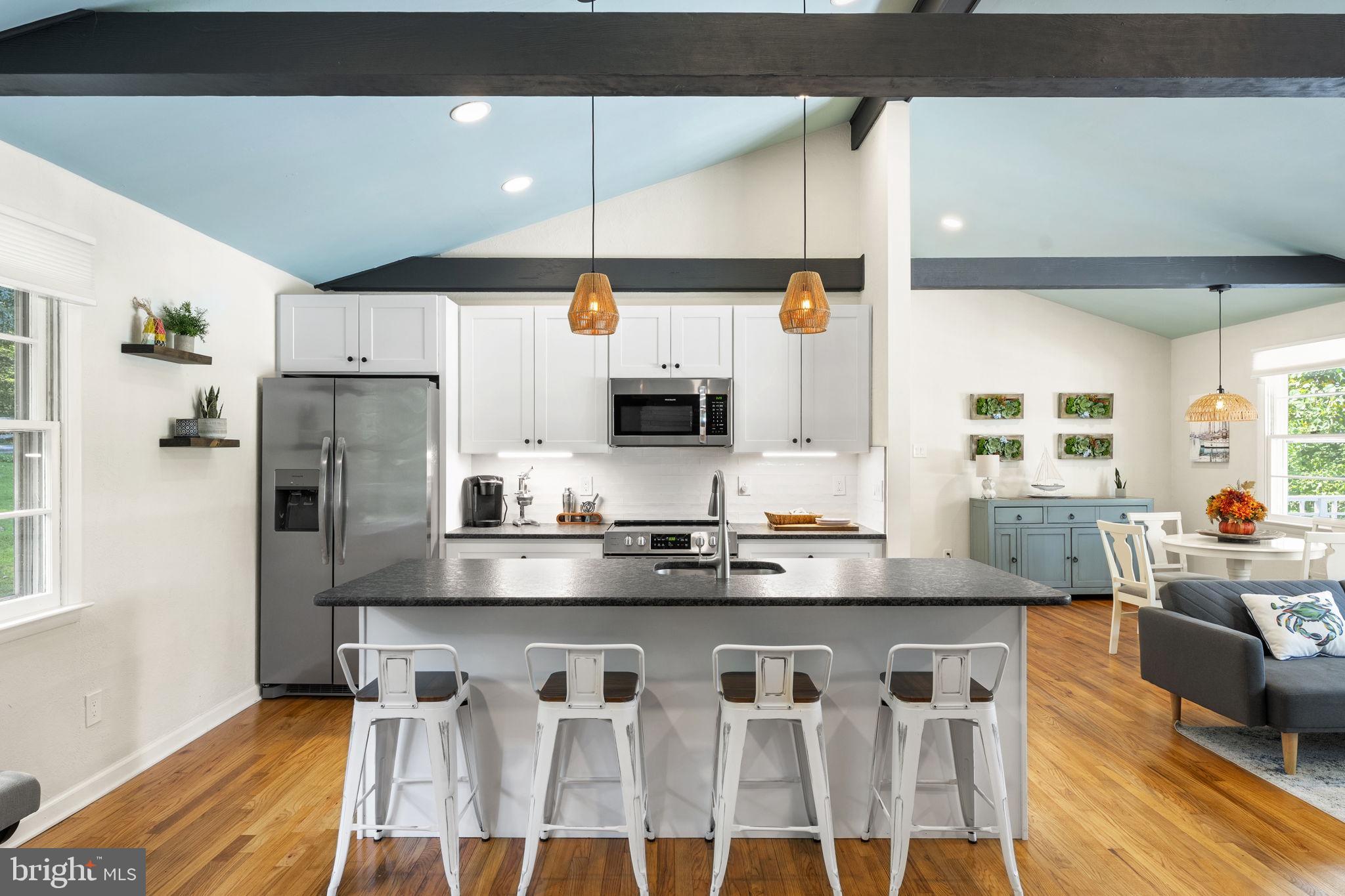 139 Knollwood Road Elkton, MD 21921 - Photo 4 of 57 a kitchen with stainless steel appliances kitchen island granite countertop a refrigerator and microwave