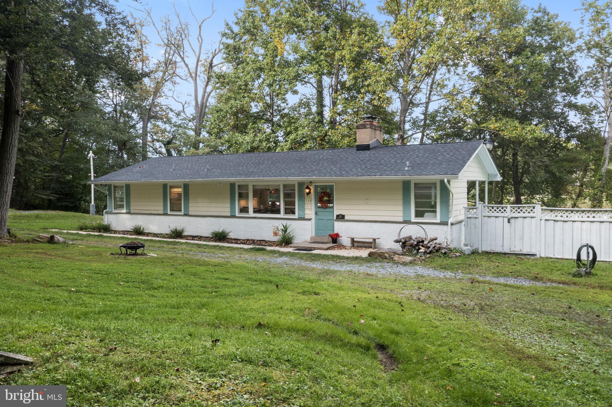 139 Knollwood Road Elkton, MD 21921 - Photo 50 of 57 a front view of a house with a yard porch and outdoor seating