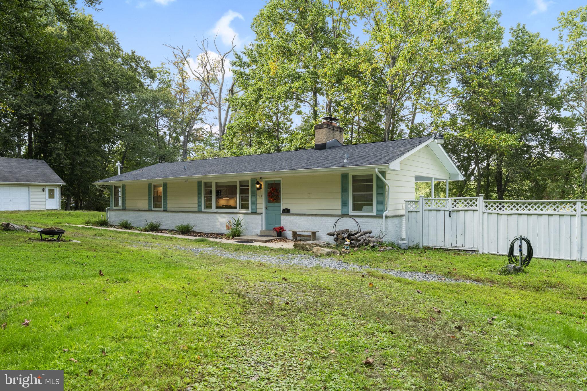 139 Knollwood Road Elkton, MD 21921 - Photo 51 of 57 a backyard of a house with barbeque oven and outdoor seating