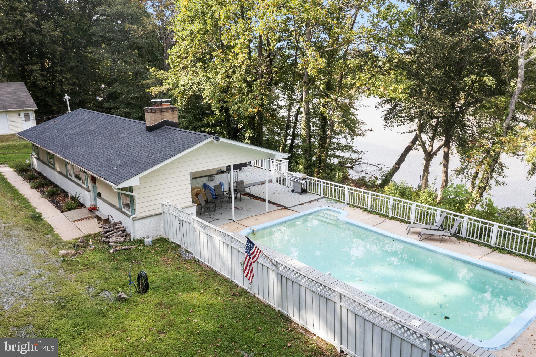 139 Knollwood Road Elkton, MD 21921 - Photo 52 of 57 a view of a house with swimming pool and sitting area
