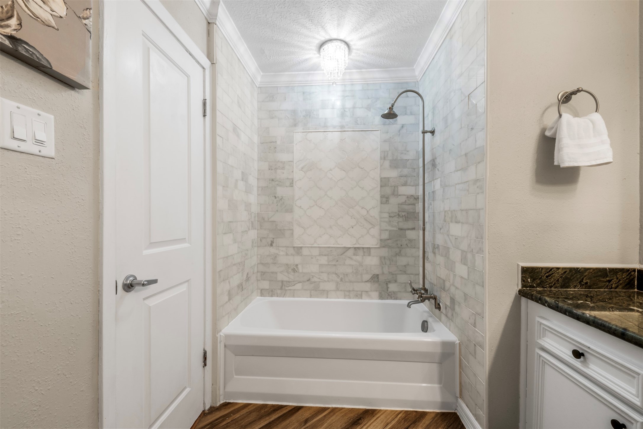 4307 Spellman Road Houston, TX 77035 - Photo 21 of 31 The hall bathroom features a beautifully updated shower and bathtub.