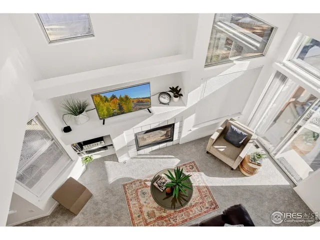 view of living room with furniture and floor to ceiling window