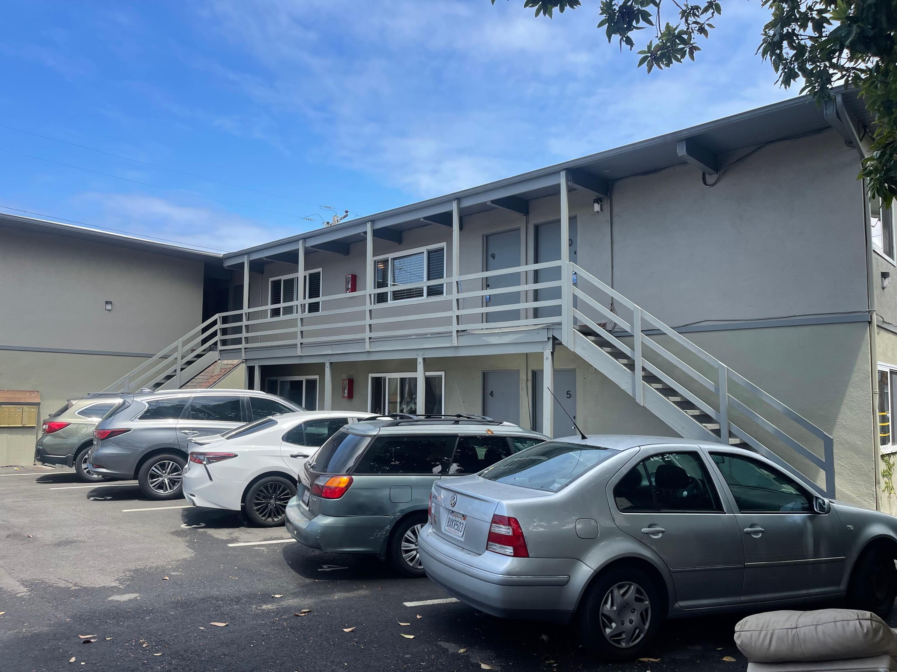 6597 Trigo Road Goleta, CA 93117 - Photo 17 of 20 a view of a cars park in front of a house