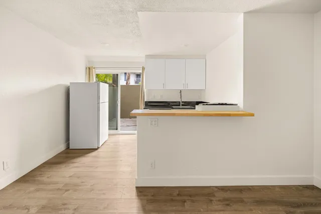 a kitchen with a sink and a refrigerator