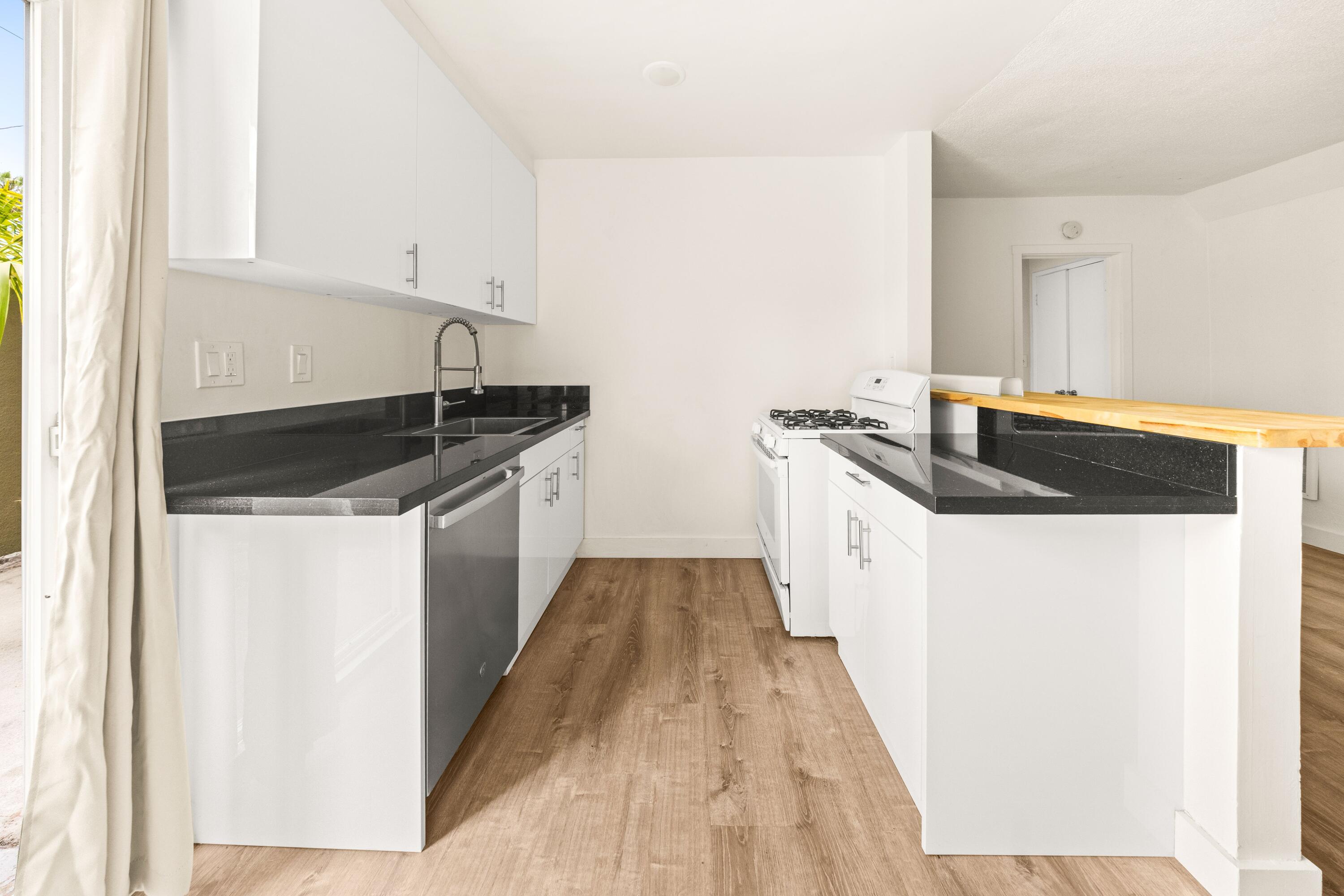 6597 Trigo Road Goleta, CA 93117 - Photo 8 of 20 a kitchen with a sink and cabinets