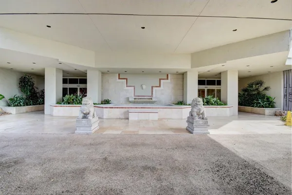 a view of a living room and kitchen area