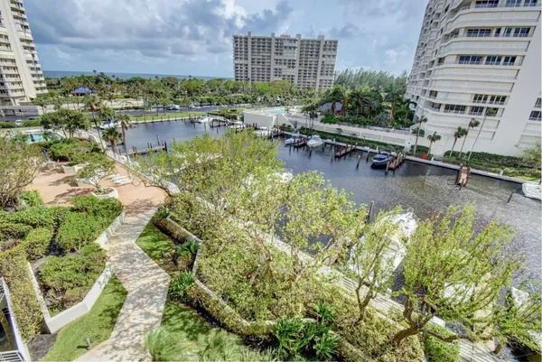 a view of building with swimming pool and outdoor seating