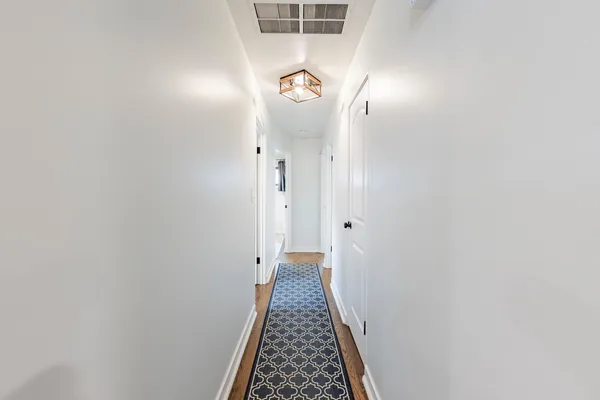 a view of hallway with mirror