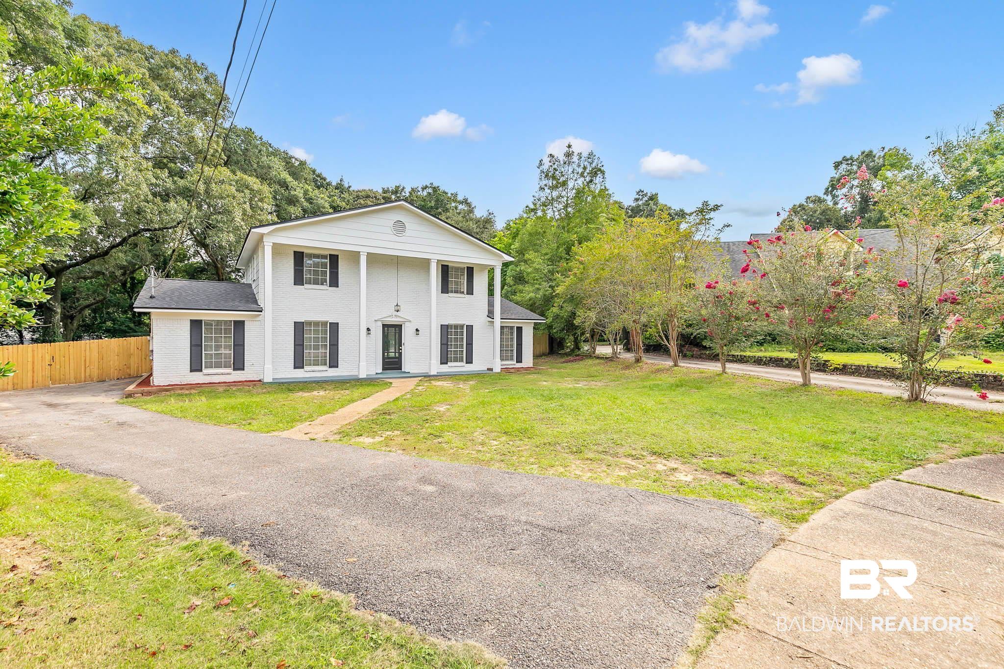 4705 Sherry Court Mobile, AL 36693 - Photo 2 of 100 Greek revival inspired property featuring brick siding and driveway