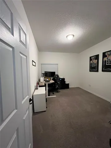a view of a livingroom with furniture and windows