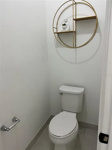 a bathroom with a toilet and a sink