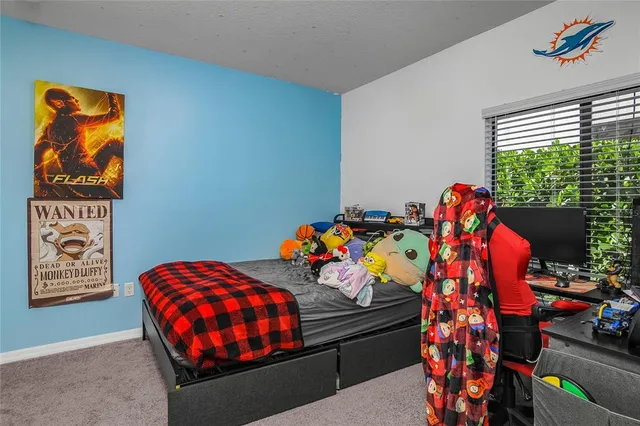 a bedroom with a bed and furniture