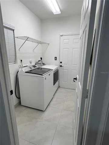 a utility room with washer and dryer
