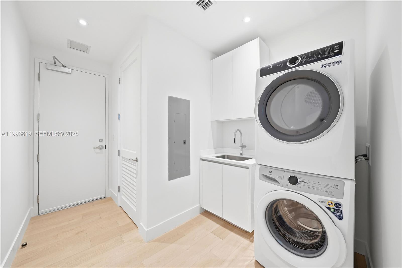 175 Southeast 25th Road, Unit 3102 Miami, FL 33129 - Photo 40 of 65 a view of a storage & utility room with dryer and washer