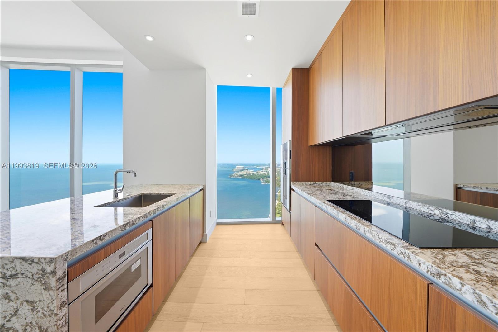 175 Southeast 25th Road, Unit 3102 Miami, FL 33129 - Photo 6 of 65 a large kitchen with stainless steel appliances granite countertop a sink and a stove