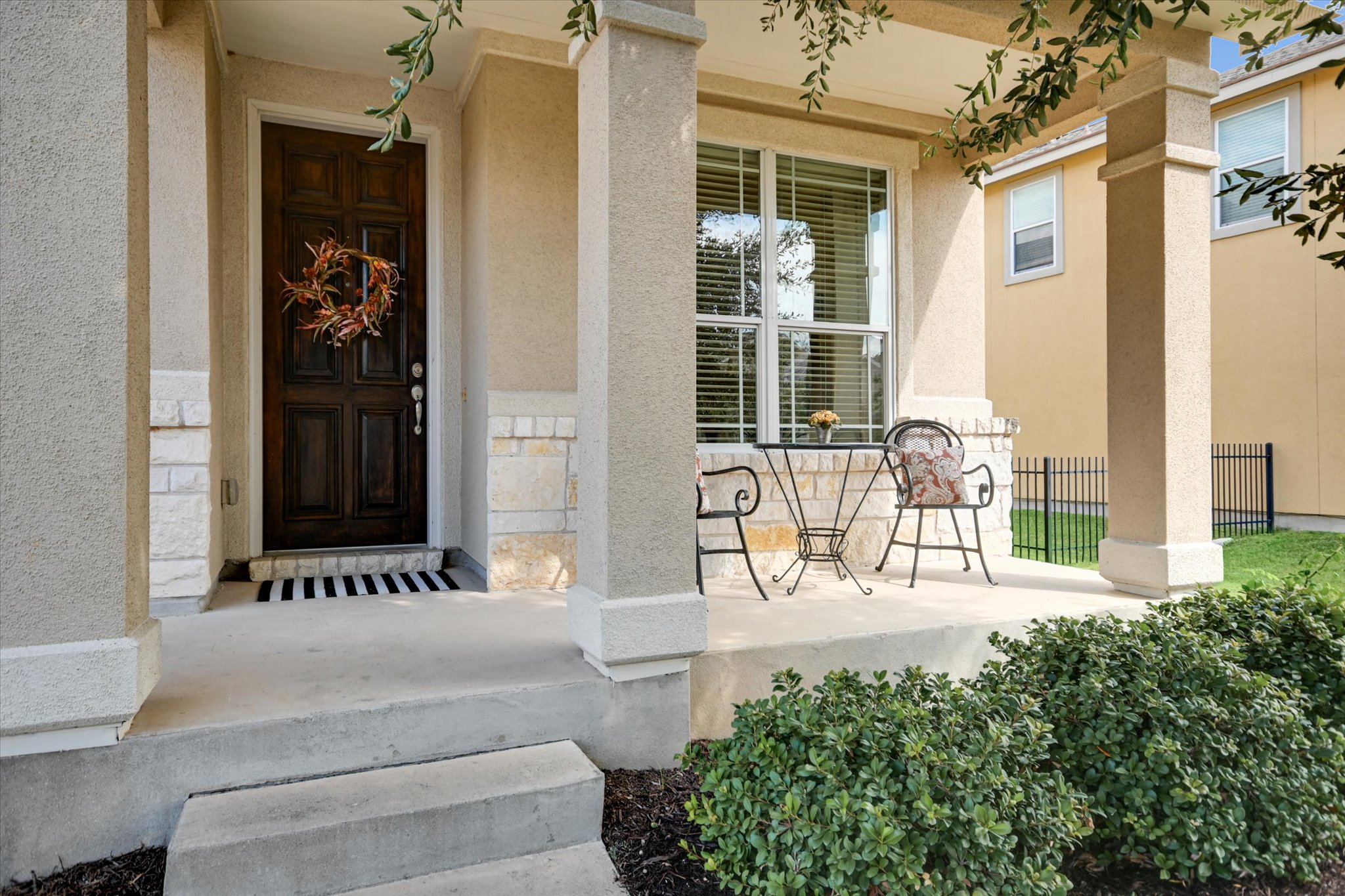7212 Lookout Bluff Terrace, Unit D18 Austin, TX 78735 - Photo 1 of 22 a front view of a house with glass windows and bench