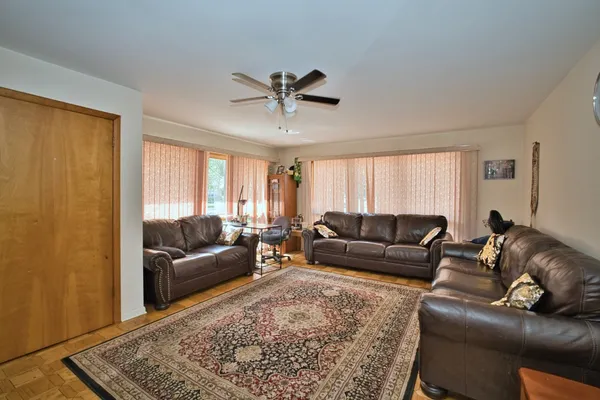a living room with a couch and a rug