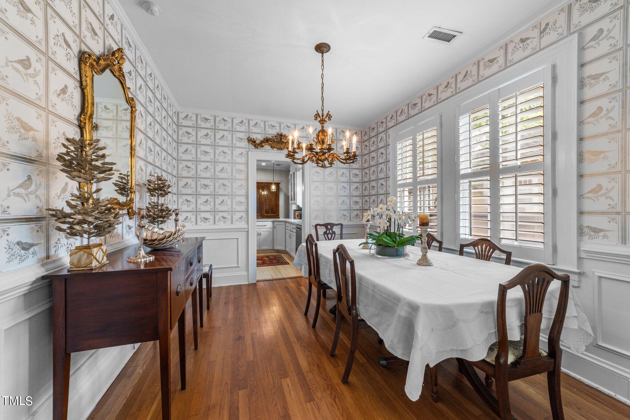 2219 Creston Road Raleigh, NC 27608 - Photo 12 of 45 a view of a dining room with furniture and window