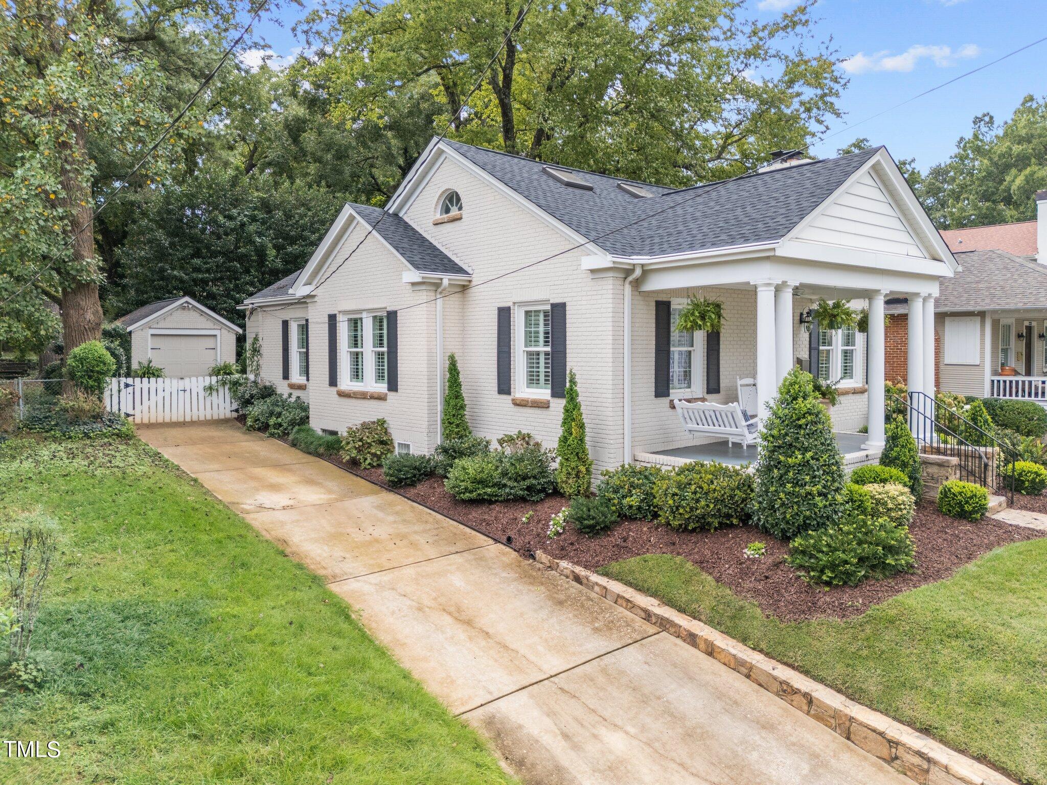 2219 Creston Road Raleigh, NC 27608 - Photo 3 of 45 a front view of a house with a yard