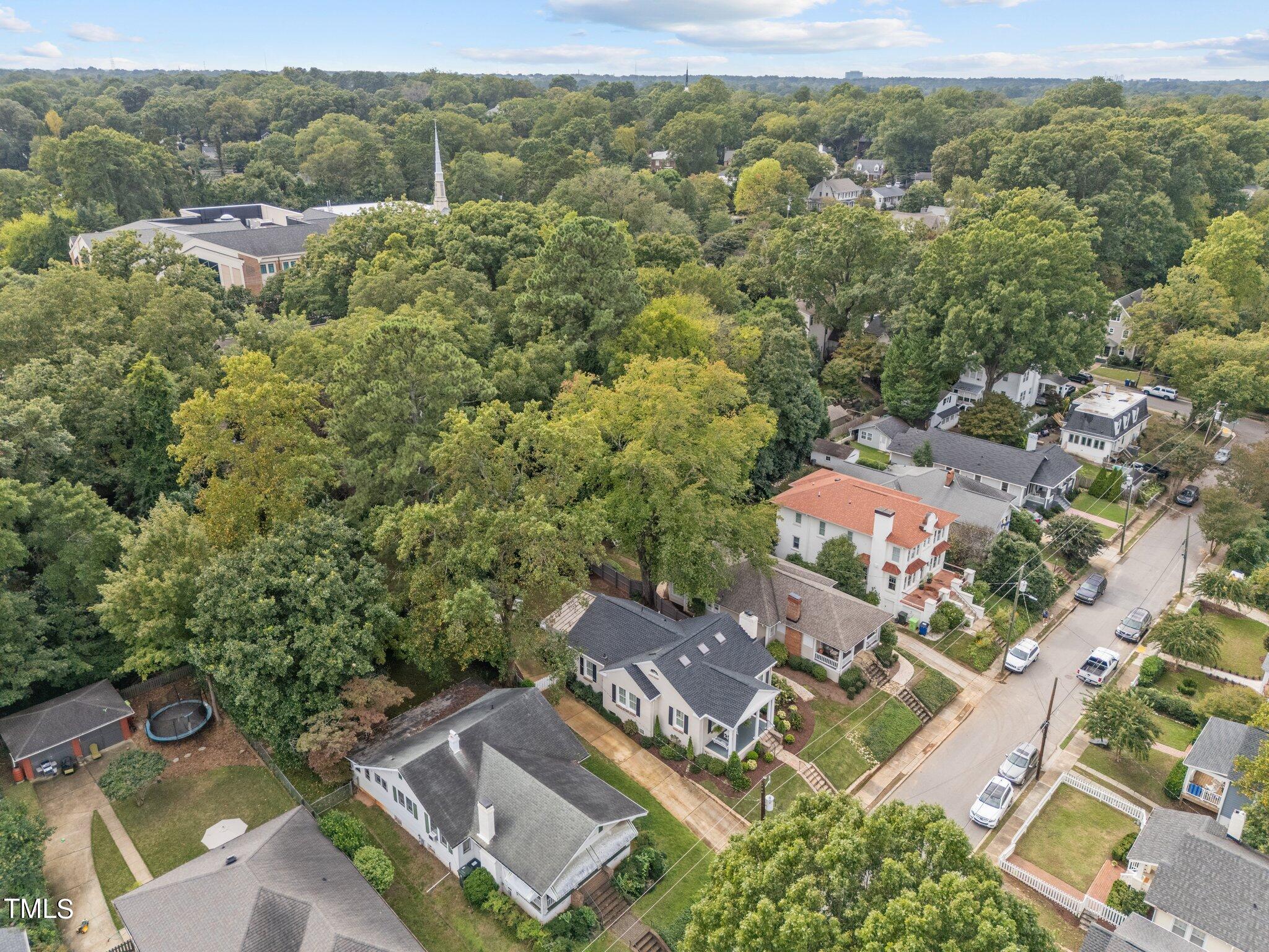 2219 Creston Road Raleigh, NC 27608 - Photo 44 of 45 an aerial view of residential house with green space