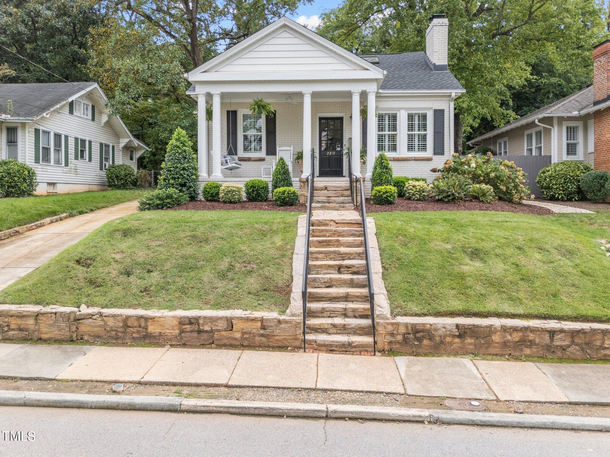 2219 Creston Road Raleigh, NC 27608 - Photo 45 of 45 front view of a house with a yard