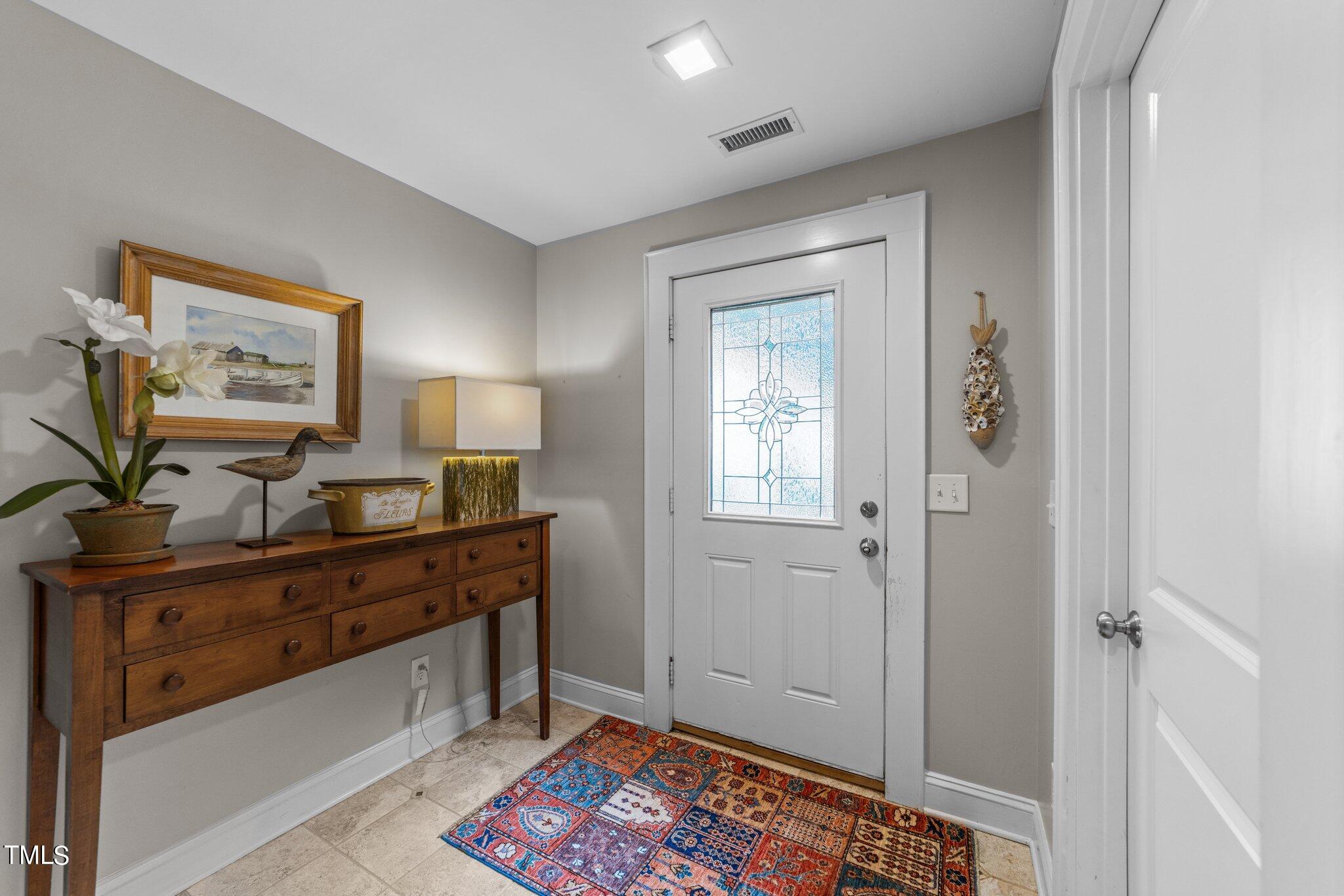 2219 Creston Road Raleigh, NC 27608 - Photo 6 of 45 a view of a workspace with furniture and window