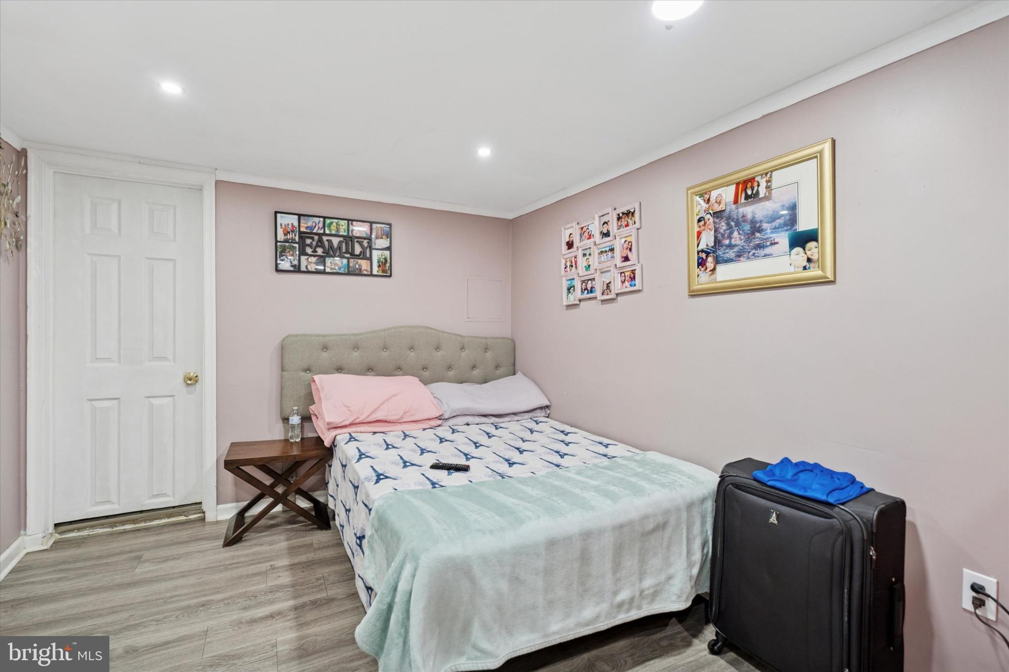 2548 Irvington Road Drexel Hill, PA 19026 - Photo 13 of 15 a bedroom with a bed and a wall painting