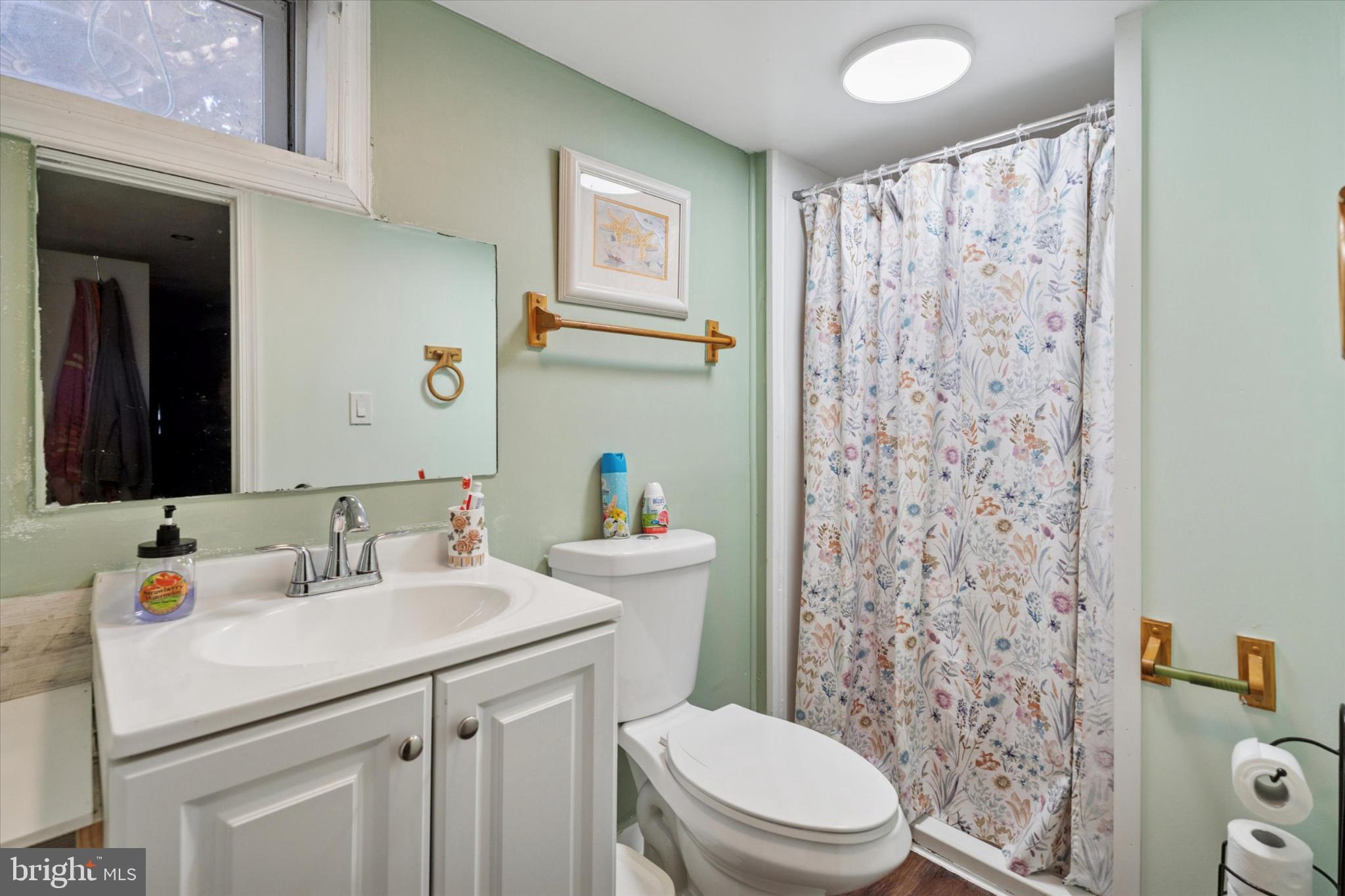 2548 Irvington Road Drexel Hill, PA 19026 - Photo 14 of 15 a bathroom with a sink toilet and shower