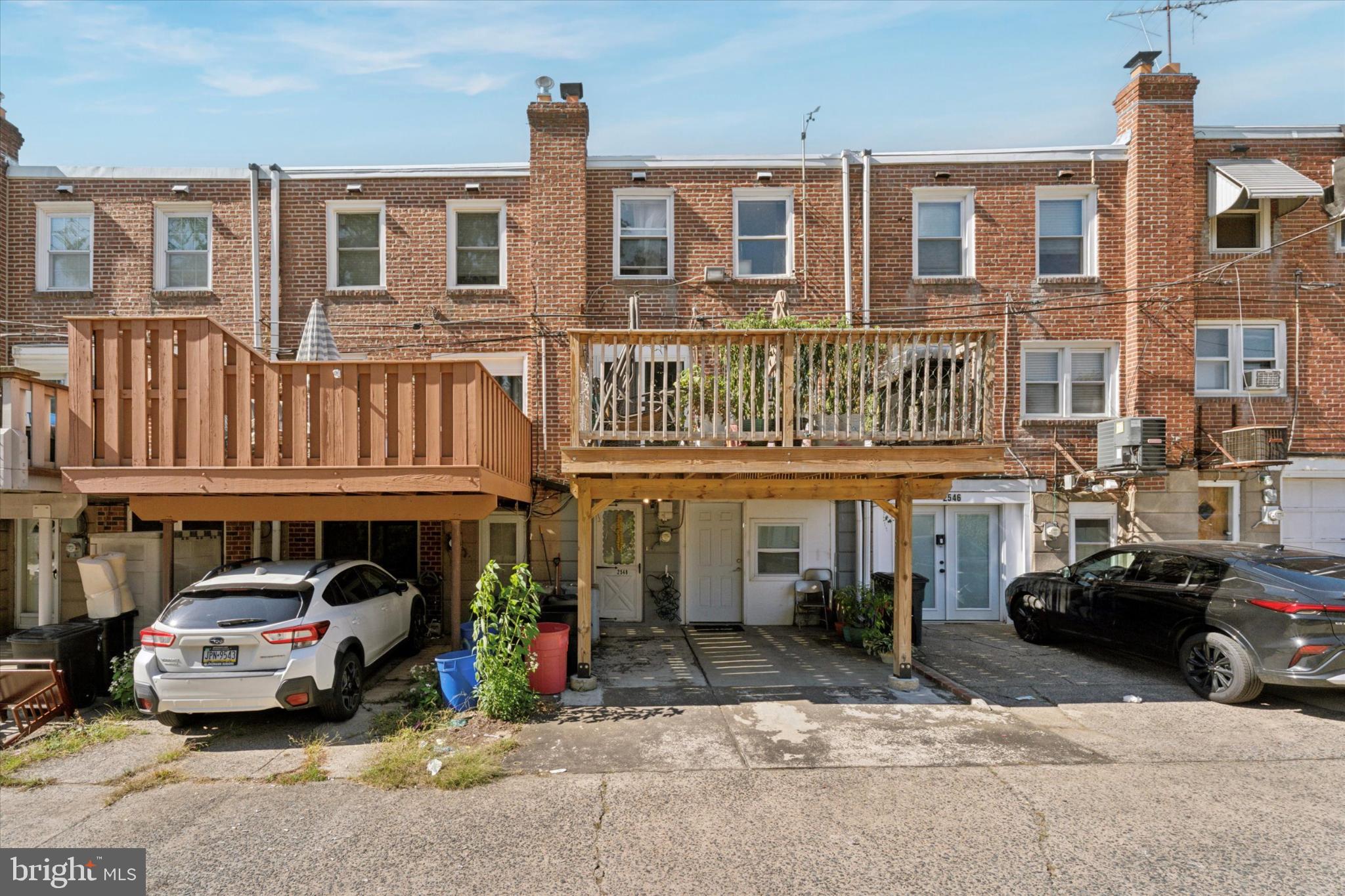 2548 Irvington Road Drexel Hill, PA 19026 - Photo 15 of 15 a couple of cars parked in front of a building