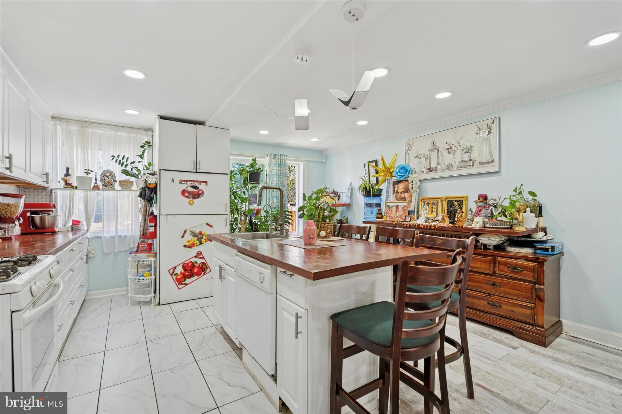 2548 Irvington Road Drexel Hill, PA 19026 - Photo 3 of 15 a kitchen that has a lot of cabinets a sink and appliances in it