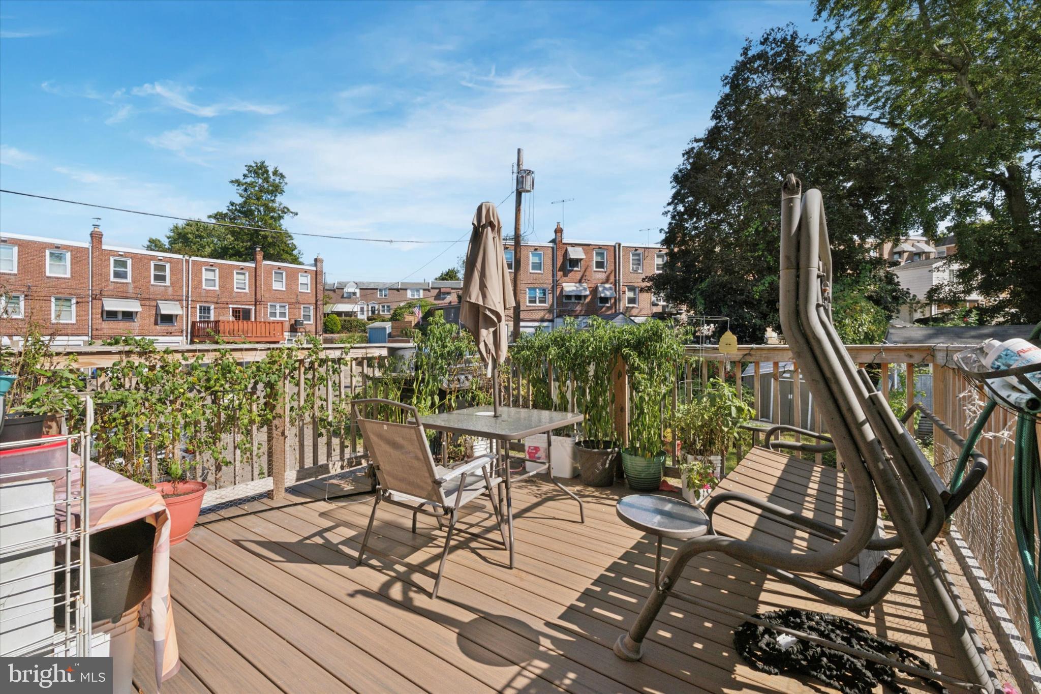2548 Irvington Road Drexel Hill, PA 19026 - Photo 5 of 15 a view of a balcony with chairs and wooden fence