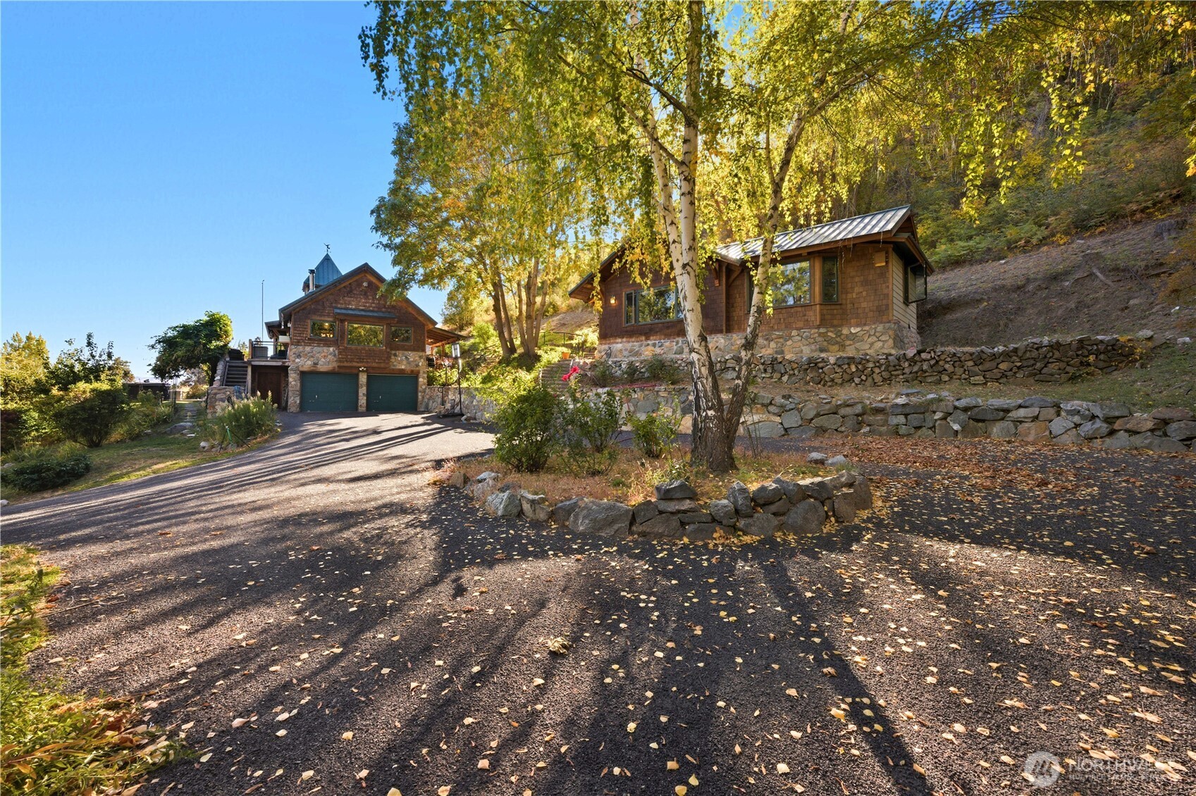 16495 South Lakeshore Road Chelan, WA 98816 - Photo 3 of 40 a view of a house with a yard