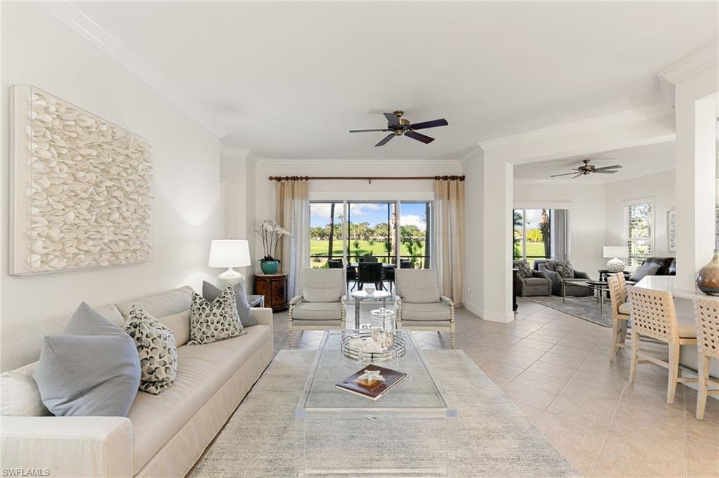 9082 Cascada Way, Unit 9102 Naples, FL 34114 - Photo 3 of 39 a living room with furniture and a large window