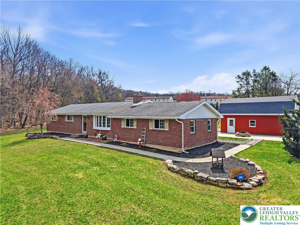 7462 Camp Meeting Road New Tripoli, PA 18066 - Photo 1 of 18 front view of a house with a yard