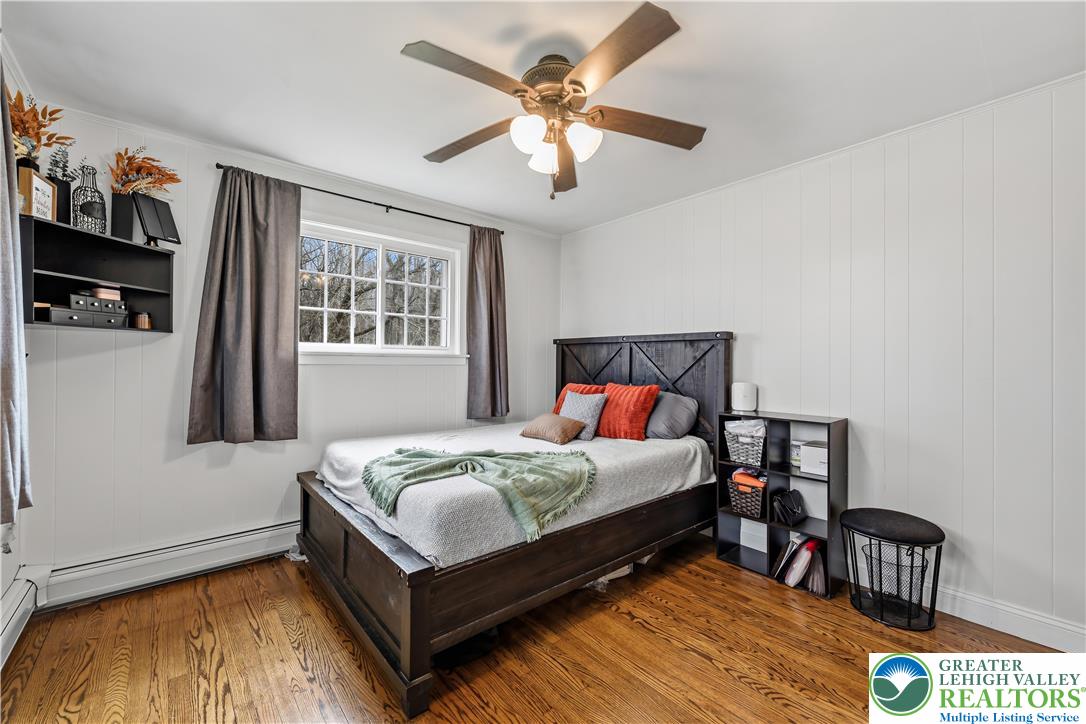 7462 Camp Meeting Road New Tripoli, PA 18066 - Photo 13 of 18 a bedroom with a bed and a chandelier