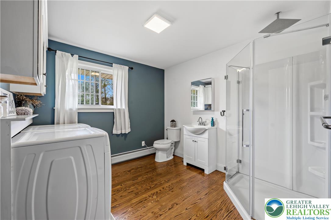 7462 Camp Meeting Road New Tripoli, PA 18066 - Photo 15 of 18 a room that has a washer and dryer with wooden floor