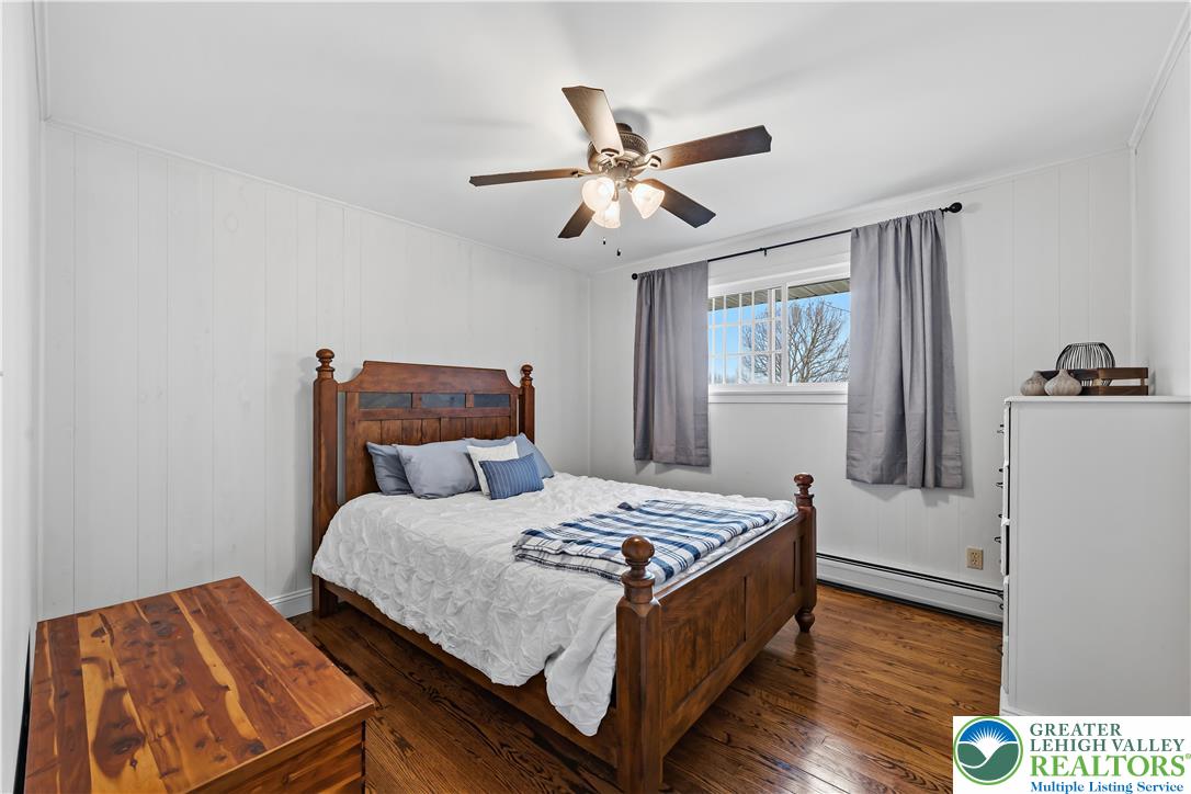 7462 Camp Meeting Road New Tripoli, PA 18066 - Photo 16 of 18 a bedroom with a bed and wooden floor