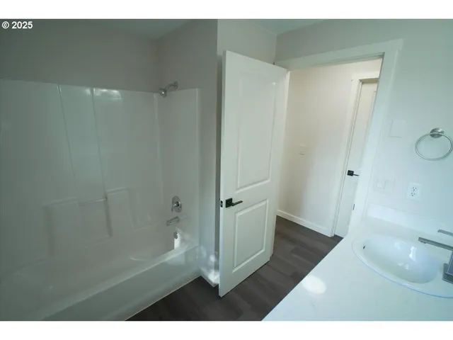 a bathroom with a sink and a shower