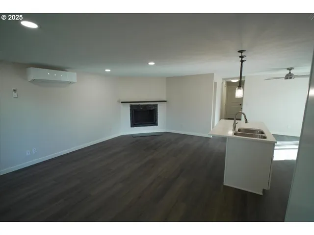 a view of a livingroom with wooden floor