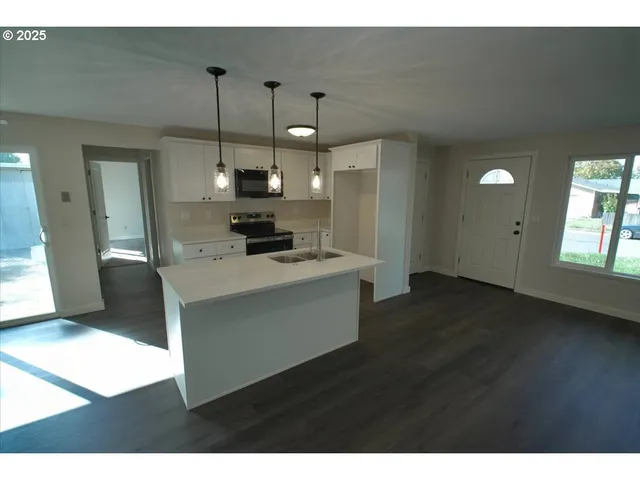 a view of a kitchen and a sink