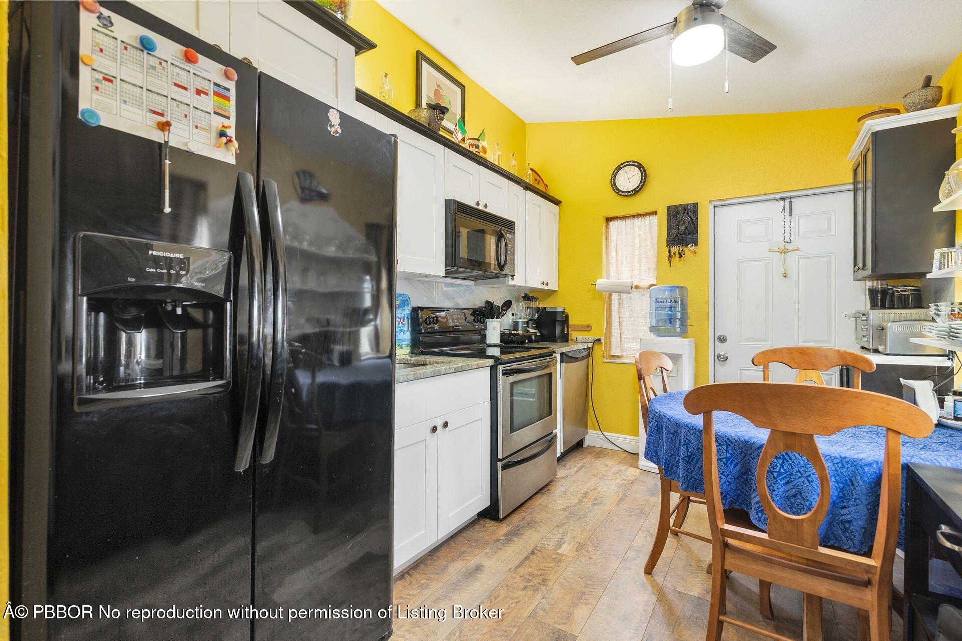 2770 E Road Loxahatchee, FL 33470 - Photo 28 of 51 a kitchen with a sink appliances and cabinets