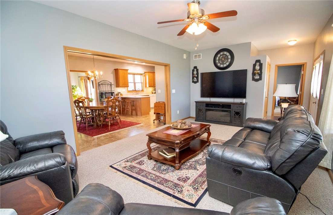 1000 Stone Road Xenia, OH 45385 - Photo 21 of 39 This inviting living room seamlessly connects to the dining area and kitchen, perfect for daily living and entertaining.
