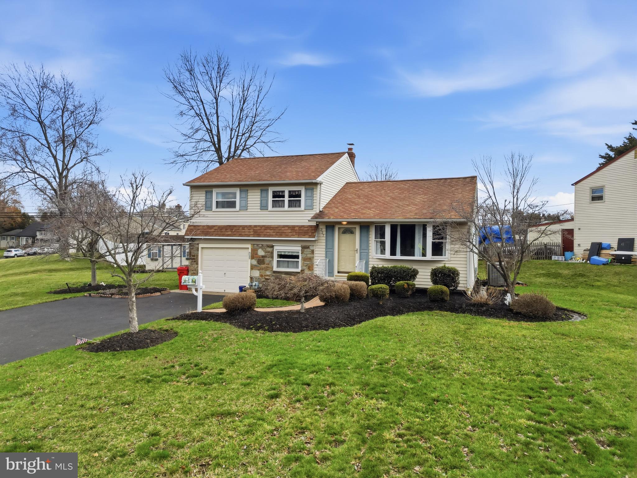 327 South Norristown Road Warminster, PA 18974 - Photo 1 of 32 a front view of a house with garden and trees