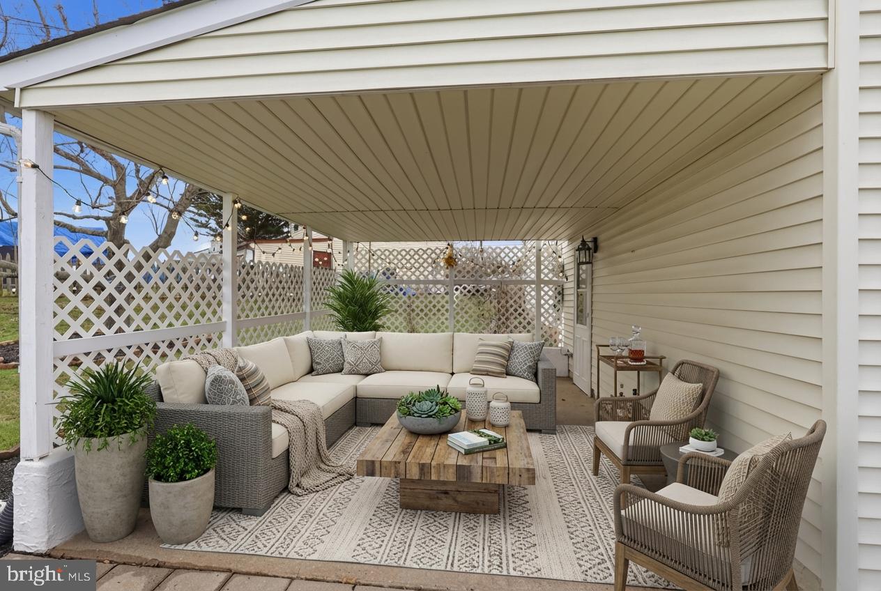 327 South Norristown Road Warminster, PA 18974 - Photo 26 of 32 a patio with patio couch and potted plants