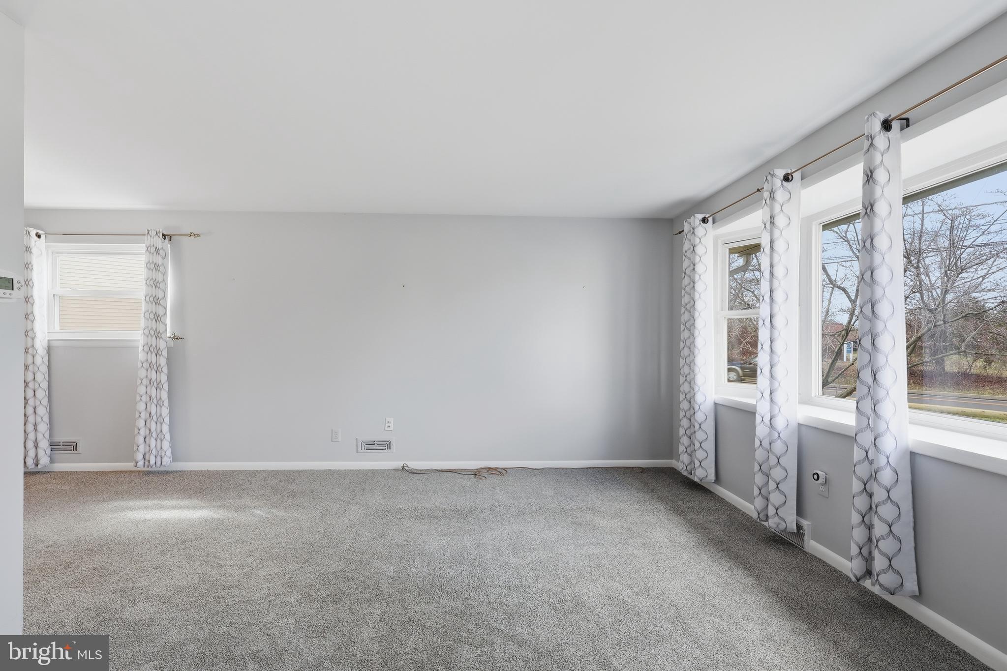 327 South Norristown Road Warminster, PA 18974 - Photo 4 of 32 an empty room with windows